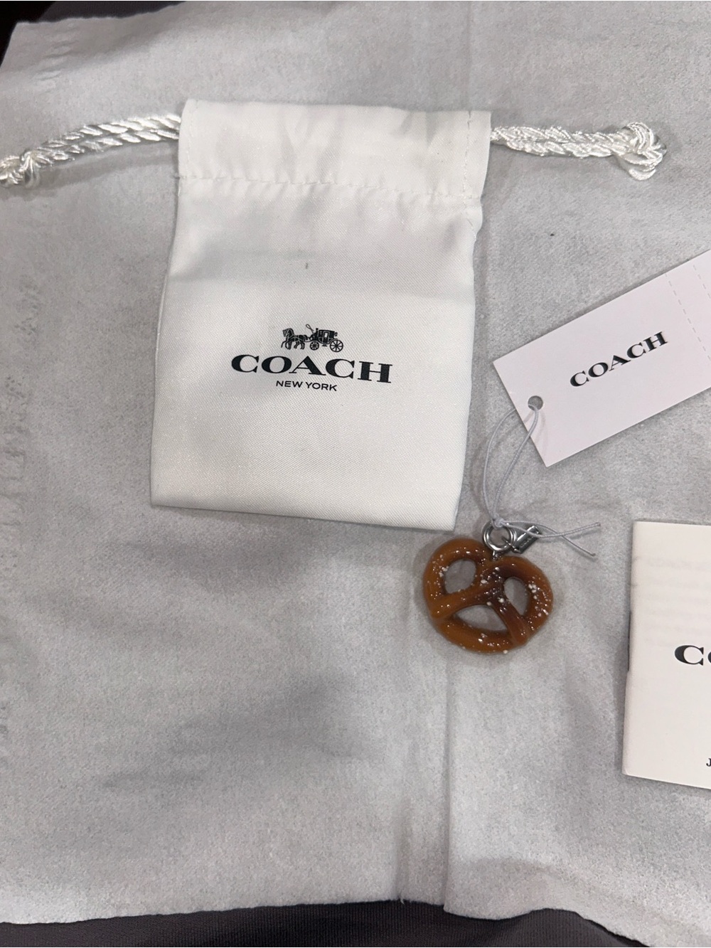 Coach Pretzel Charm with micro hang tag, care booklet, tag & Dust Bag. NWT - Picture 4 of 7